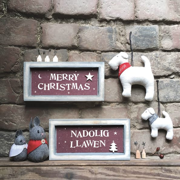 East of India Grey Box Frame Sign | Nadolig Llawen Welsh Sign East of India Long Grey Wooden Box Frame Sign - Nadolig Llawen
