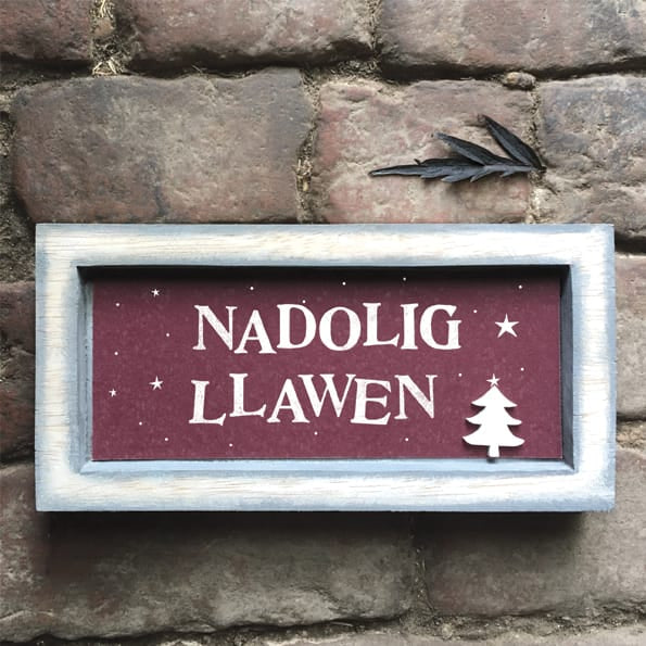 East of India Grey Box Frame Sign | Nadolig Llawen Welsh Sign East of India Long Grey Wooden Box Frame Sign - Nadolig Llawen