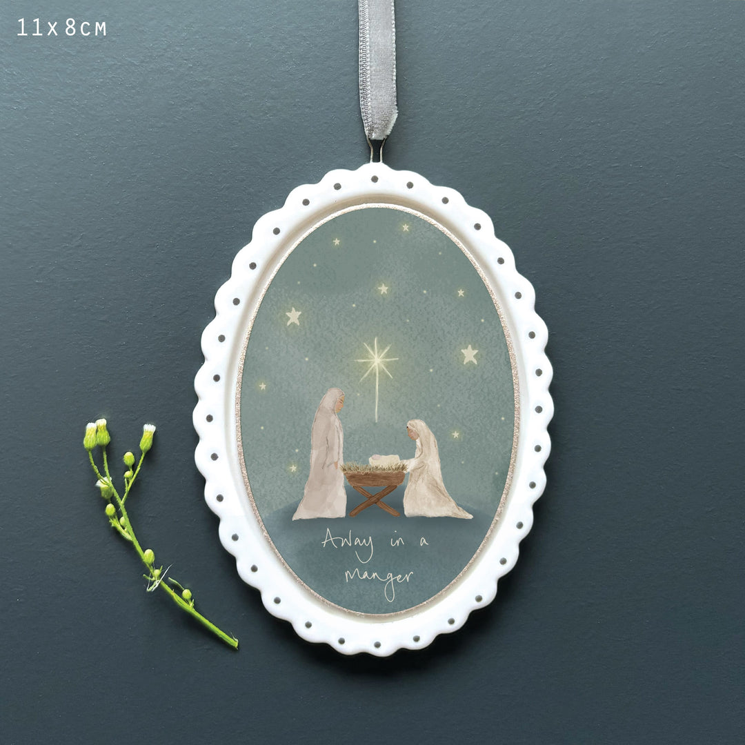 Porcelain Christmas Tree Decoration, Away in a Manger | East of India Hanging Decoration East of India Porcelain Scallop Oval Christmas Tree Decoration - Away in a Manger